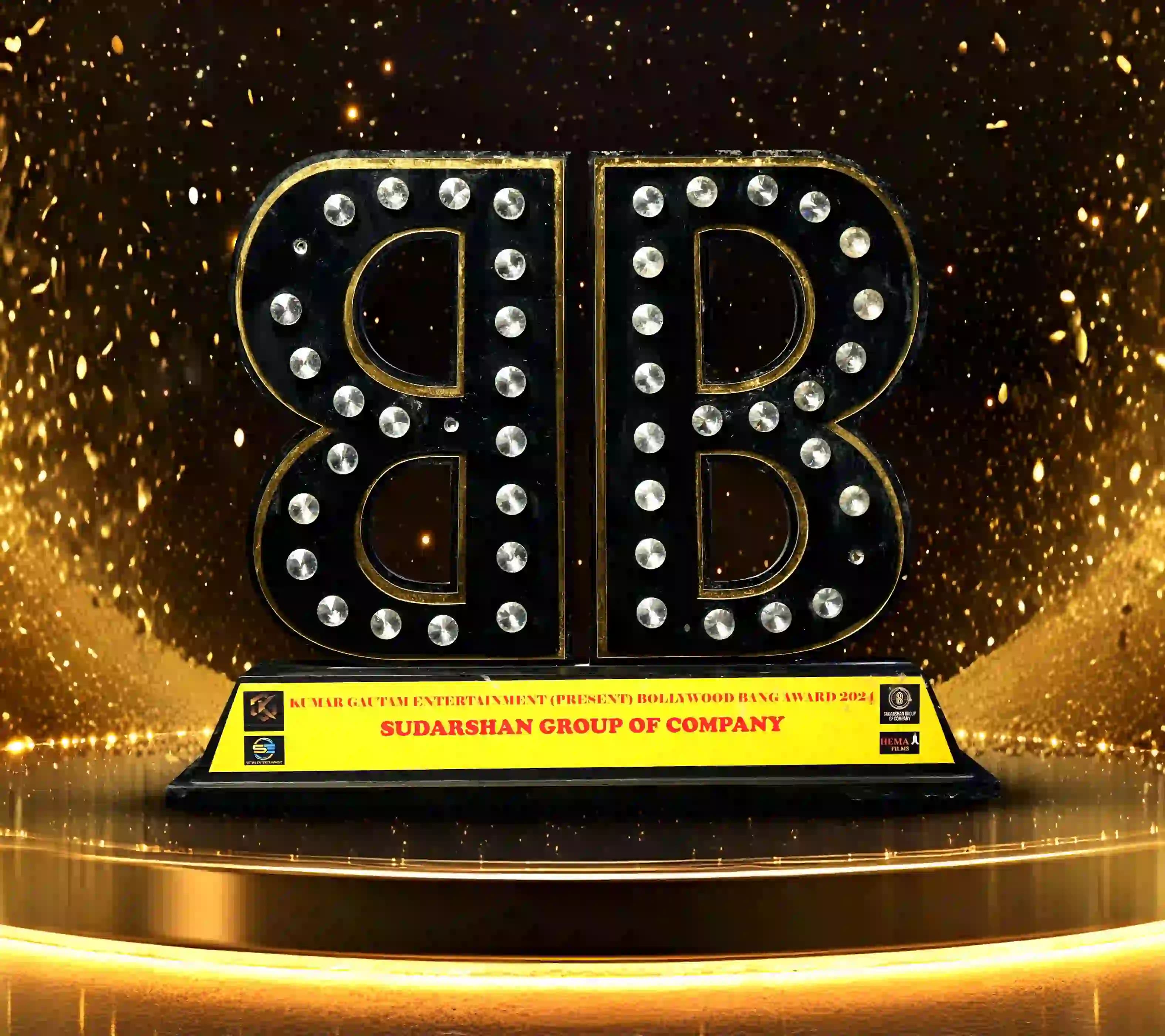 Bollywood Rising Award 2024 trophy presented to Sudarshan Group of Company in recognition of excellence and outstanding achievement.